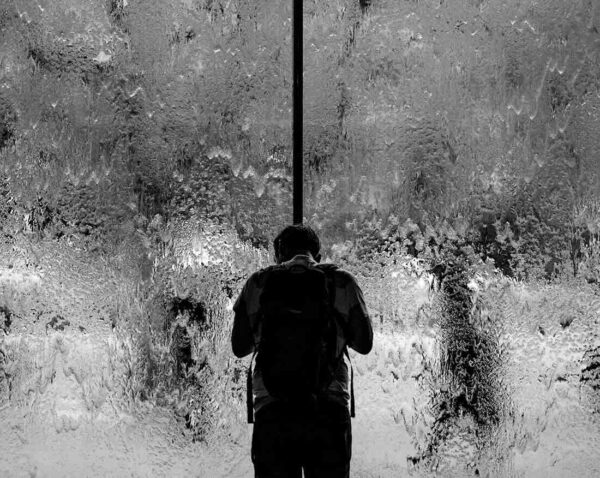 man alone heavy rainfall