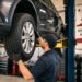 A California mechanic swaps in a new and more costly replacement tire.